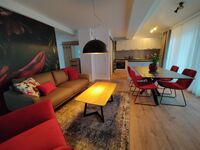 Wohnzimmer mit Esszimmer und Küche Wohnzimmer mit Esszimmer und Küche