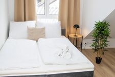 Schlafzimmer 2 mit einem Doppelbett Schlafzimmer 2 mit einem Doppelbett