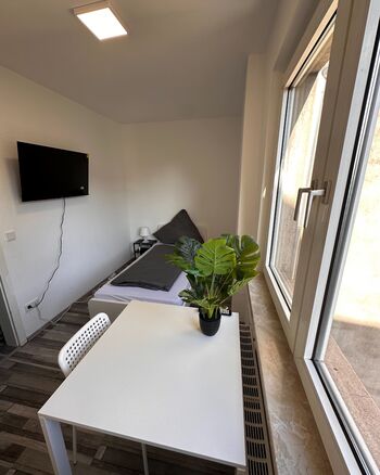 Top ausgestattetes Apartment mit Doppelzimmern&Einzelbetten Bild 3