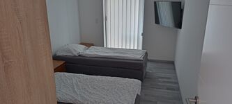 Zwei Häuser - Wohnungen Zimmer zu Vermieten Bild 12