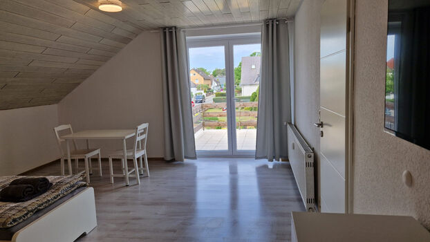 Zimmer mit Balkon