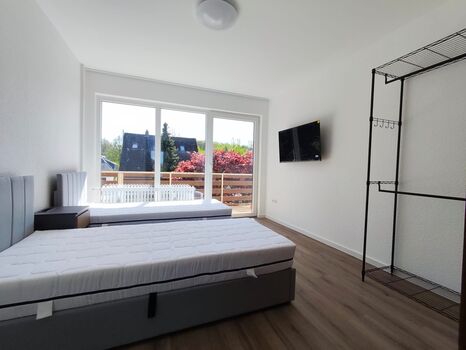 Schlafzimmer mit Balkon