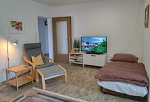 Zustellbett im Wohnzimmer